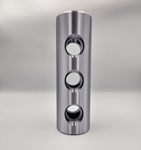 3D printed 1:1 scale 30mm Bushmaster muzzle brake replica in silver PLA