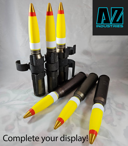 3D printed 30mm brass shell casing topper displayed upright on surface