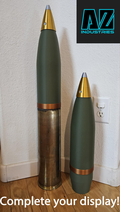 3D printed 105mm brass shell casing replica topper displayed on surface
