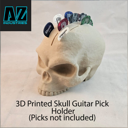 3D printed skull guitar pick holder displayed with guitar picks inside